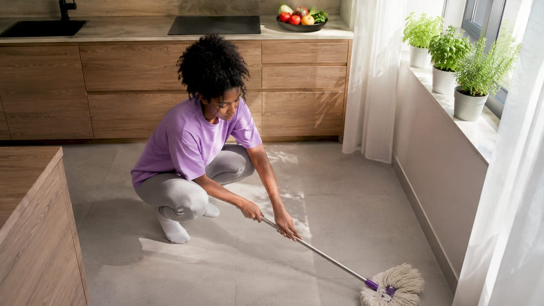 Woman vacuuming carpet in clean living room